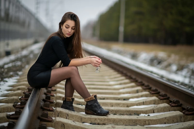 Girl Sitting On Railway Line 4k Wallpaper