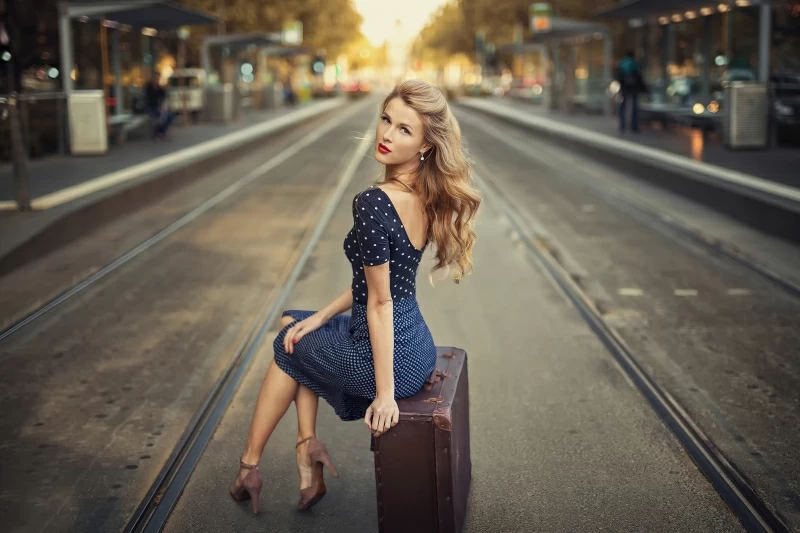 Blonde Girl Sitting Suitcase Train Station 4k Wallpaper