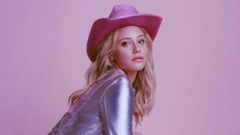 Actress American Blonde Girl Lili Reinhart Is Wearing Shiny Dress And Pink Hat In Pink Background 4K 5K HD Girls Wallpaper