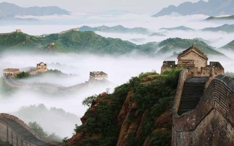 Man Made Great Wall of China with white cloud and green mountains Wallpaper