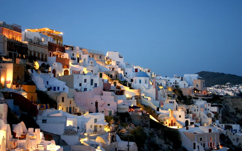 Man Made Santorini houses with lights Wallpaper