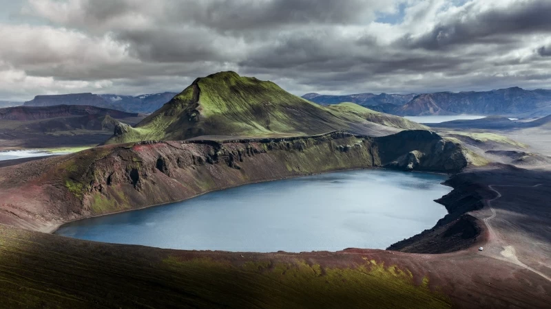 Green Mountain Water Under Cloudy Sky 4K 5K HD Wallpaper