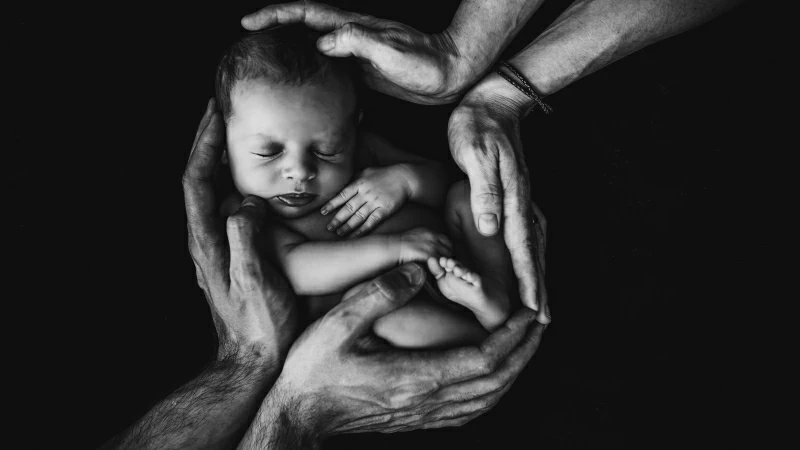 Grayscale Phone Of Hugging Baby 4K 8K HD Wallpaper