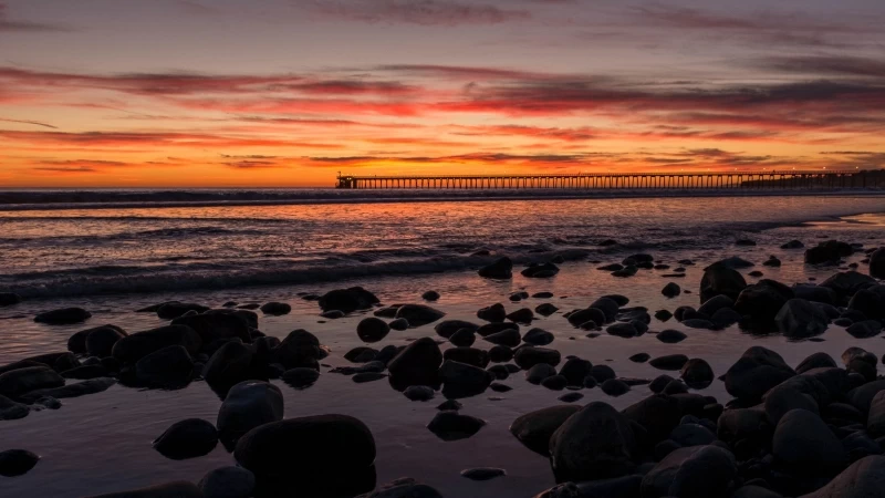 Sunset Bridge Sea Rocks Clouds 4K HD Wallpaper