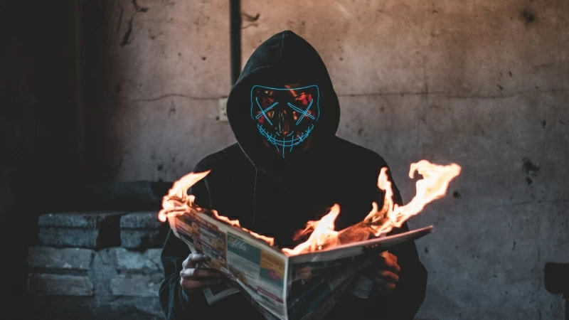 Mask Guy Reading A Burning News Paper 4K HD Wallpaper