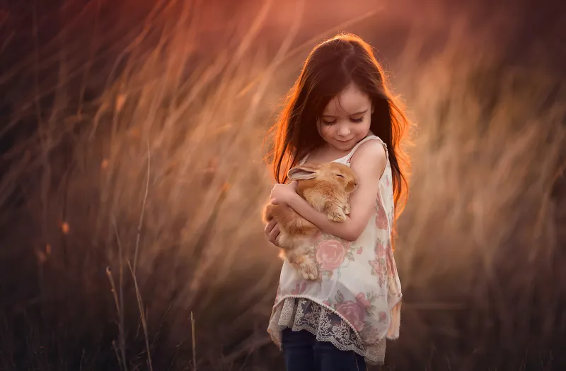 Little Girl With Rabbit In Hands 4k Wallpaper