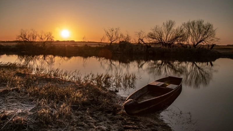 Boat Landing Between Lake Under Sunset 4K 5K HD Wallpaper