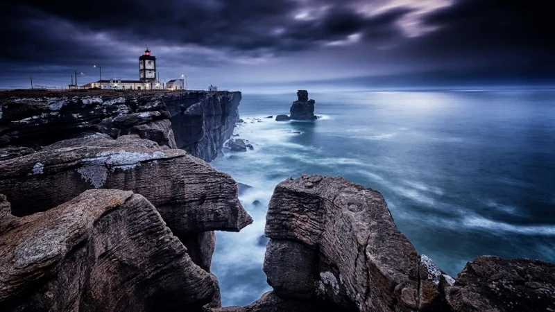 Man Made Lighthouse Between Seashore With Black And White Rocks HD Nature Wallpaper