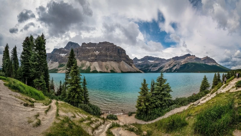 Mountain View Covered White Clouds Between Lake Surrounding Green Trees Of Banff National Park 4K 5K HD Nature Wallpaper