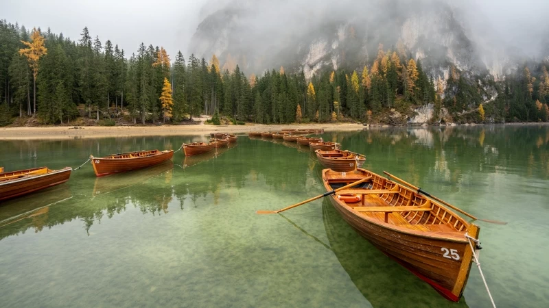 Snow Covered Mountain Under Boat Between Lake During Daytime 4K HD Nature Wallpaper