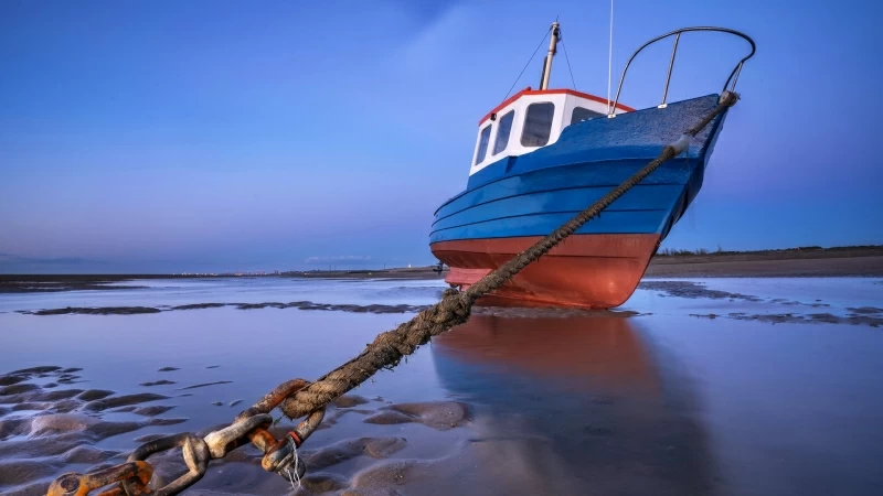 Blue Sky and Fishing Boat Trapped By An Anchor Caught On A Rope HD Nature Wallpaper