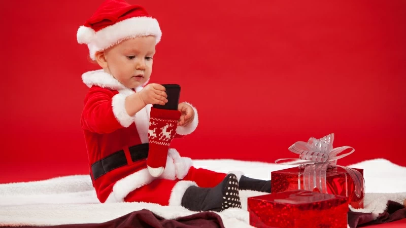 Cute Baby Wearing Christmas Dress In Front Of Gifts 4K 5K HD Cute Wallpaper