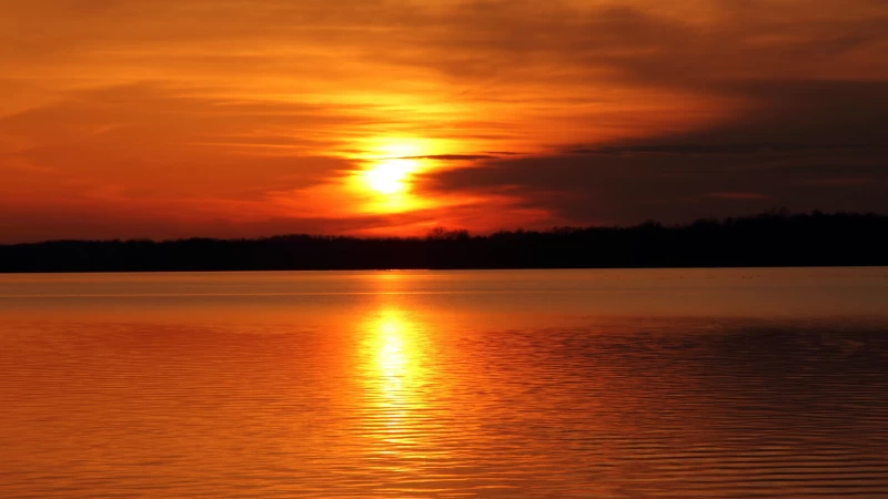 Green Trees River Under Orange Yellow Clouds Sky Moon Reflection On Water During Sunset 4K HD Nature Wallpaper