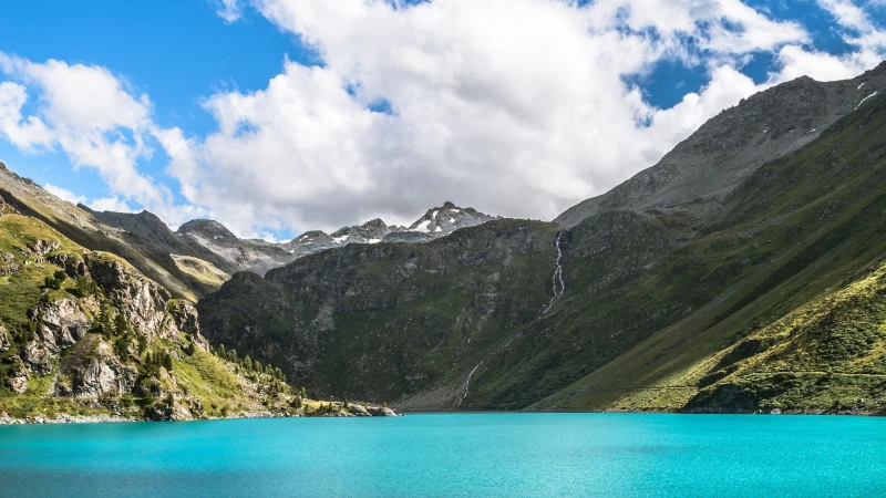 Landscape View Of Greenery Mountains Waterfall River In White Clouds Blue Sky Background 4K HD Nature Wallpaper