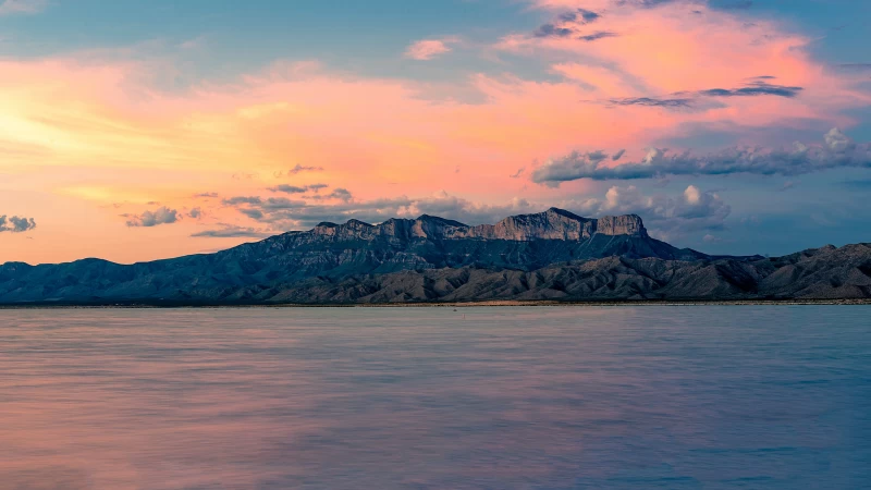 Landscape View Of Mountains Ocean Under White Clouds Yellow Pink Blue Sky 4K HD Nature Wallpaper